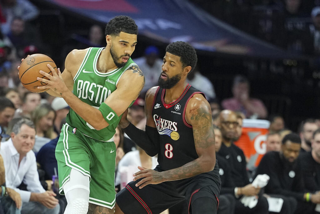 Jayson Tatum of the Boston Celtics drives against Paul George in the Celtics' victory over the Philadelphia 76ers in game three of their NBA playoff series