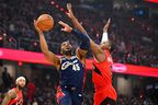 Cleveland's Donovan Mitchell #45 of the Cleveland Cavaliers shoots over RJ Barrett of the Toronto Raptors  during Game 2 of their NBA playoff series Monday night.