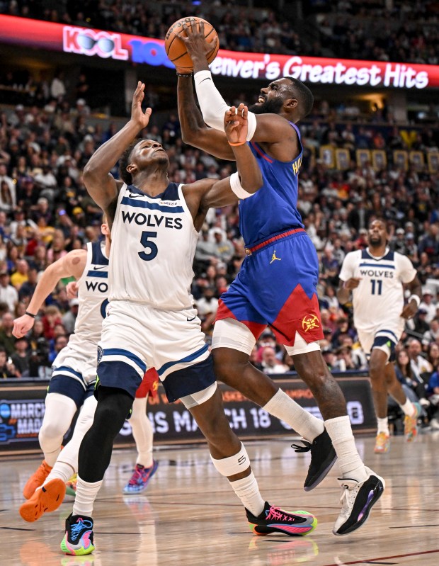 Anthony Edwards (5) of the Minnesota Timberwolves fouls Tim Hardaway Jr. (10) of the Denver Nuggets during the fourth quarter of the Timberwolves' 117-108 win at Ball Arena in Denver on Sunday, March 1, 2026. (Photo by AAron Ontiveroz/The Denver Post)