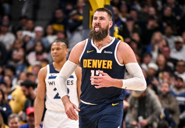 Jonas Valanciunas (17) of the Denver Nuggets reacts after drawing a foul from Jaylen Clark (22) of the Minnesota Timberwolves during the fourth quarter of the Nuggets' 125-113 win in game five of their NBA Playoffs series on Monday, April 27, 2026. The Timberwolves lead 3-2 as they head back to Minneapolis for game six. (Photo by AAron Ontiveroz/The Denver Post)