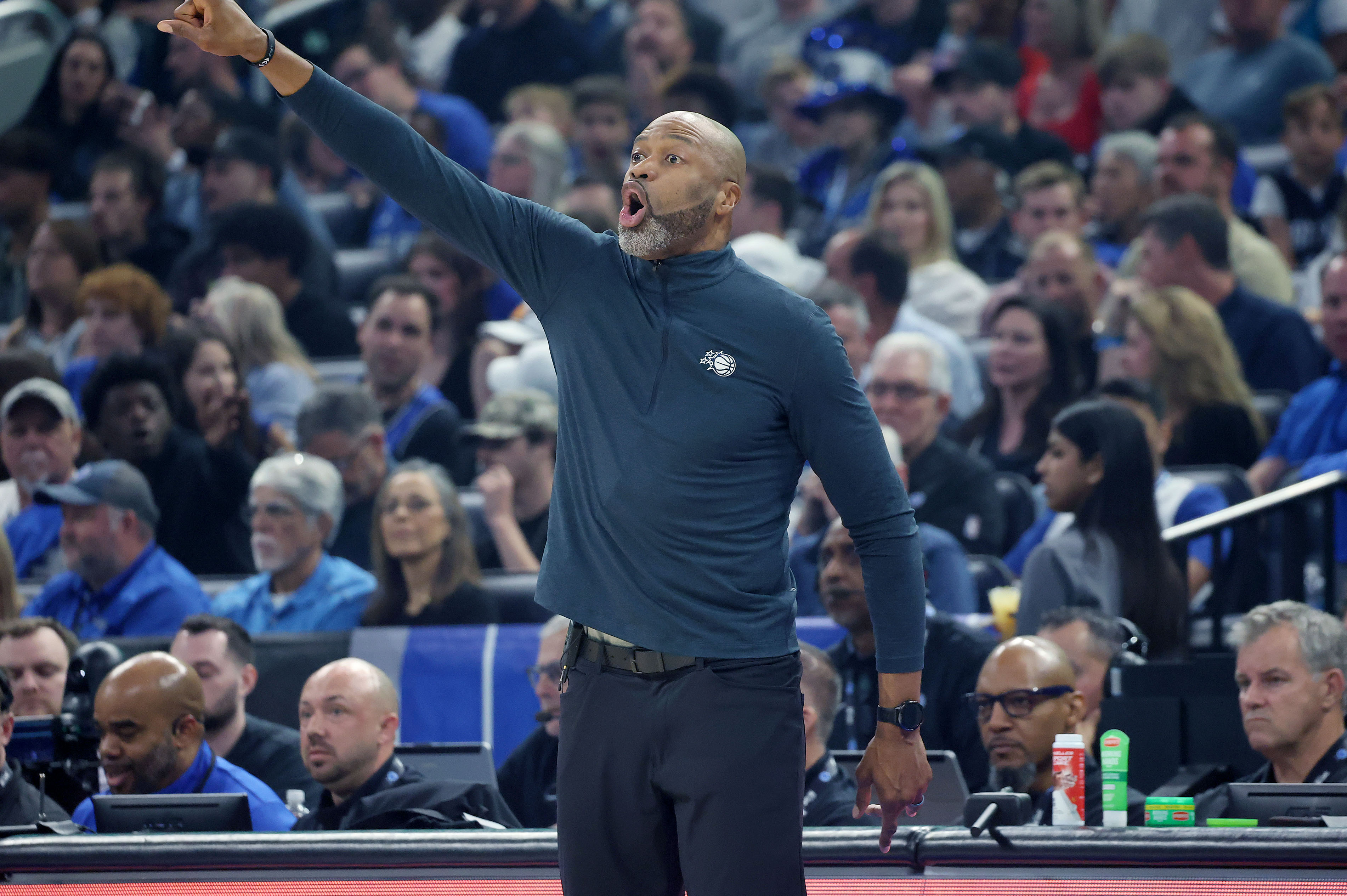 Orlando coach Jamahl Mosley signals during the Charlotte Hornets at...