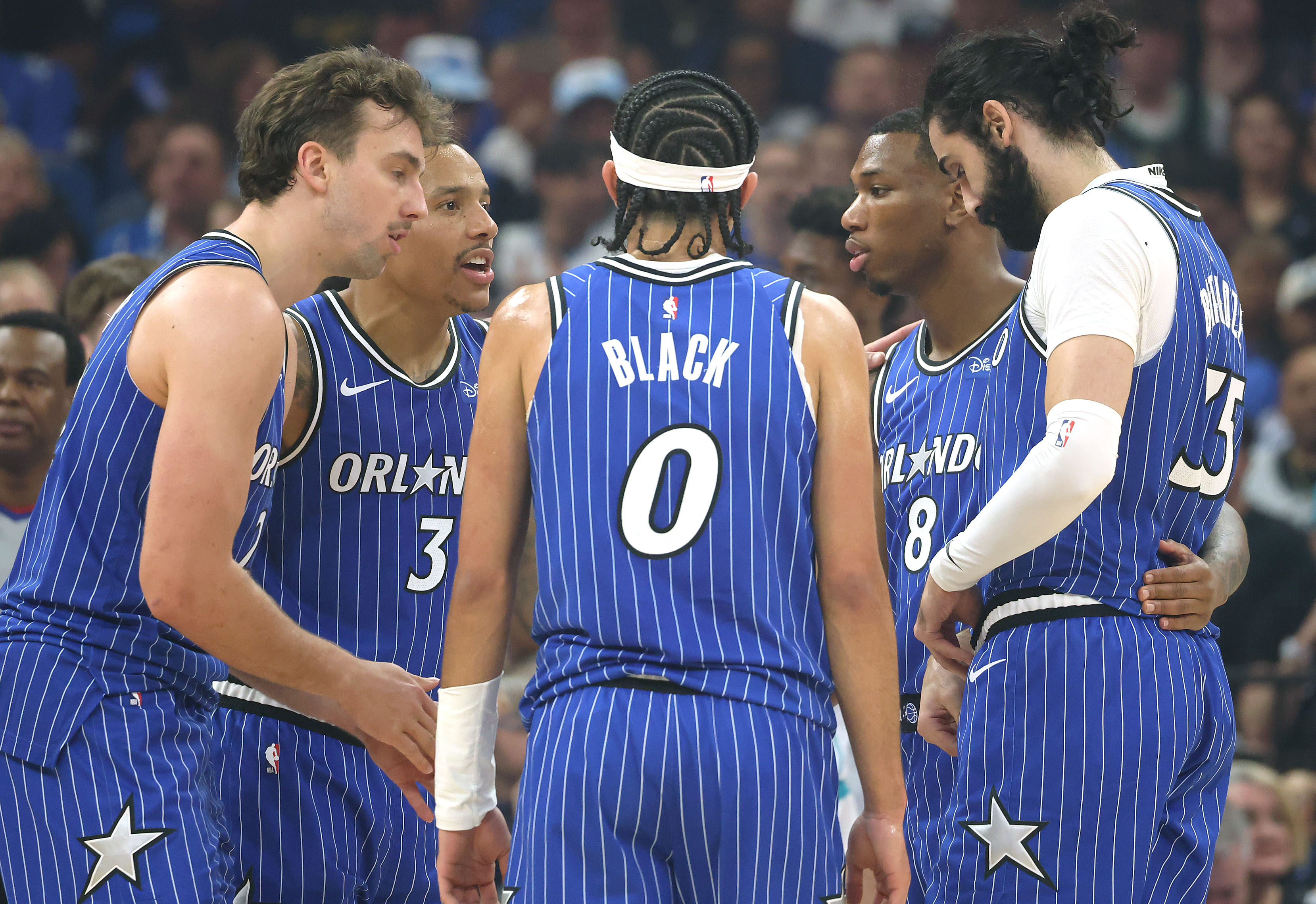 Orlando players huddle during the Charlotte Hornets at Orlando Magic...