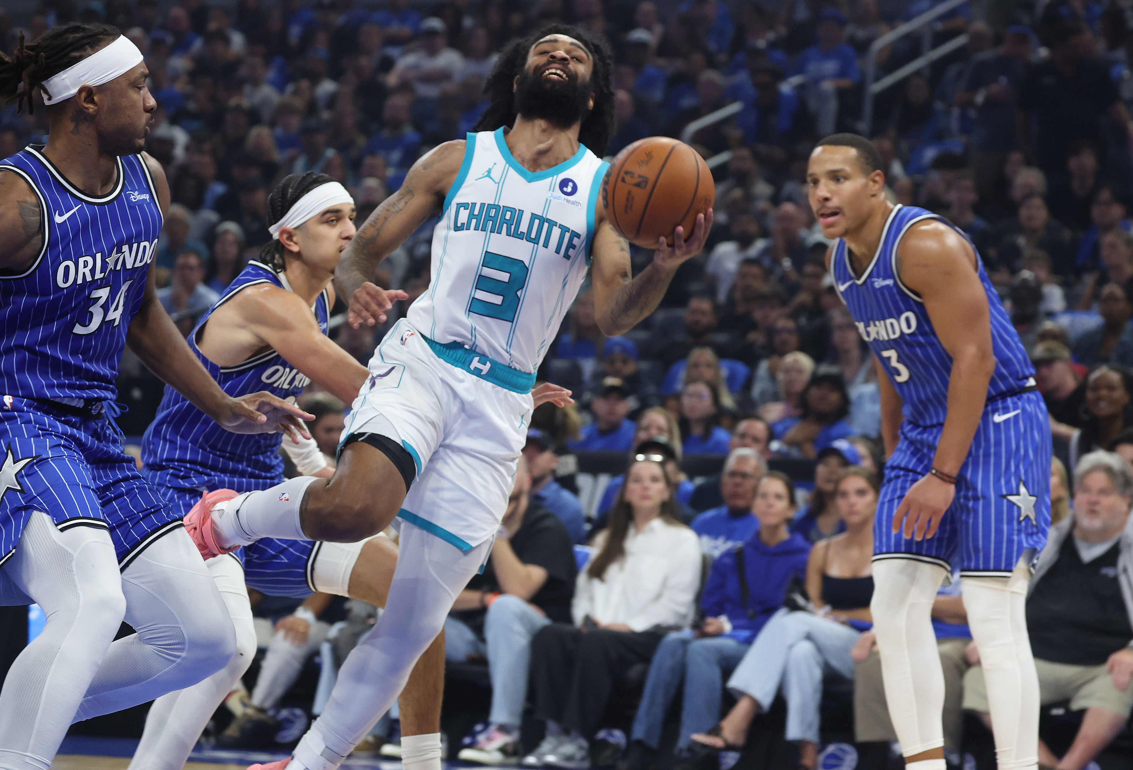 Orlando guard Coby White (3) stumbles during the Charlotte Hornets...