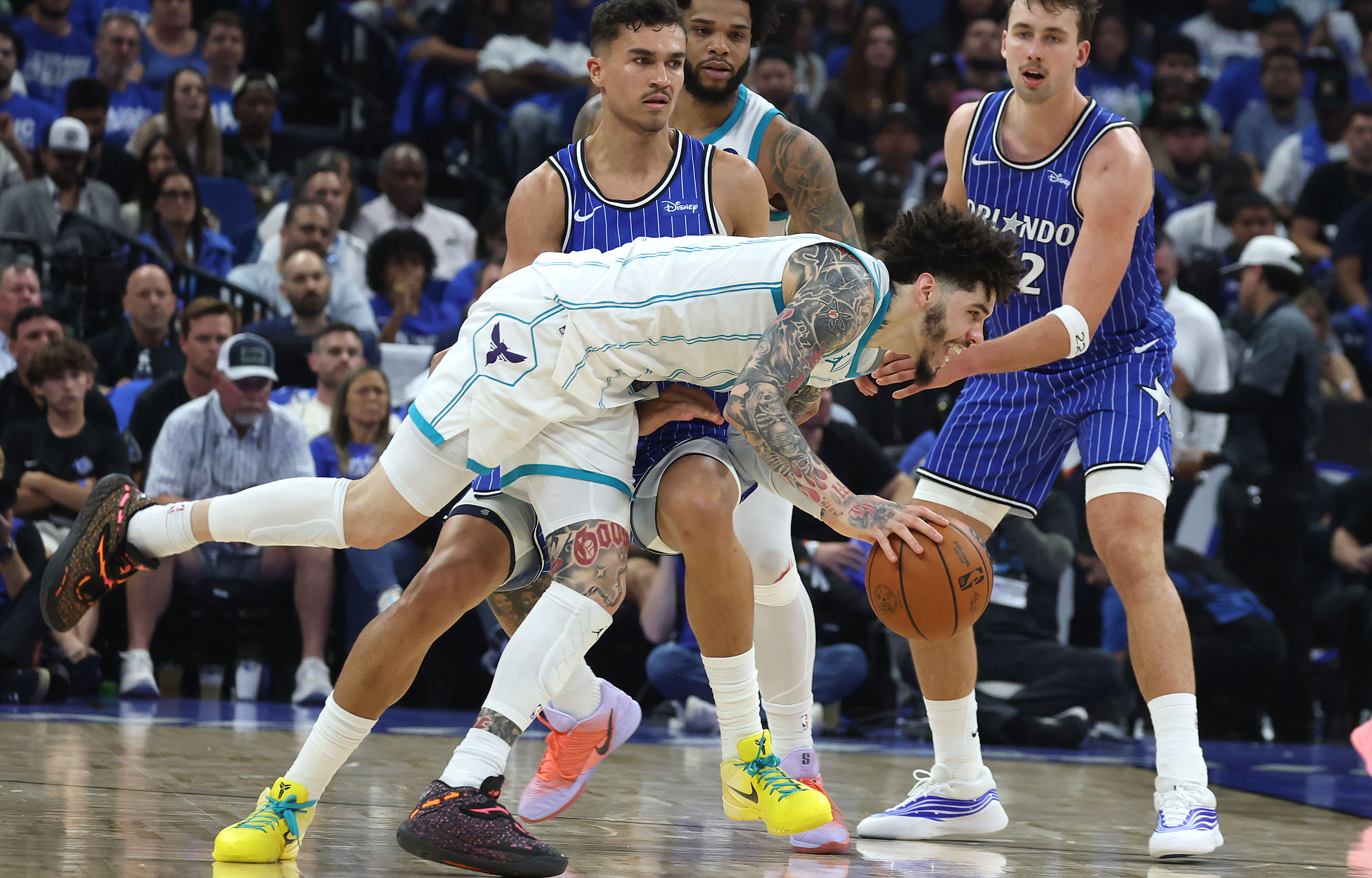 Charlotte guard LeMelo Ball falls during the Charlotte Hornets at...