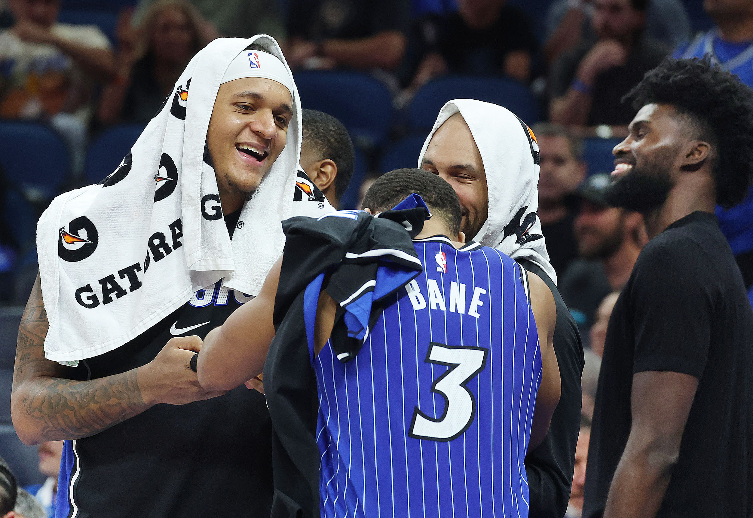 Orlando players, from left: Paolo Banchero, Desmond Bane (3), Jalen...