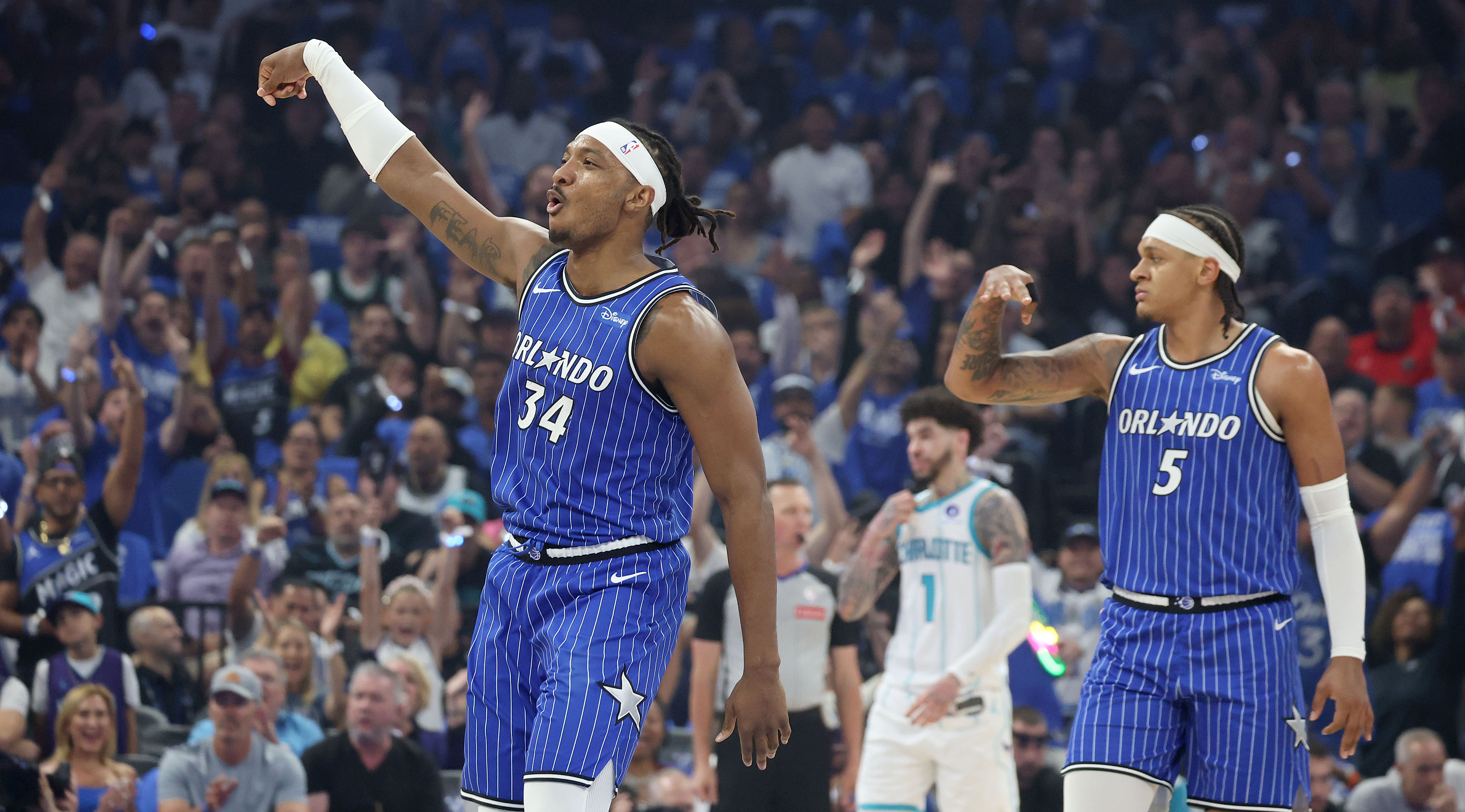 Orlando forward Paolo Banchero (5) and Orlando center Wendell Carter...
