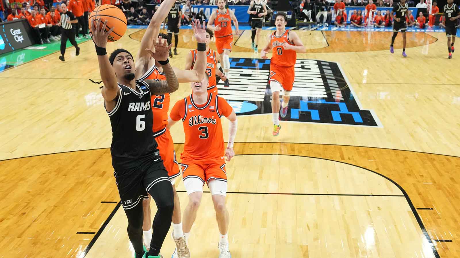 Mar 21, 2026; Greenville, SC, USA; VCU Rams guard Terrence Hill Jr. (6) shoots as Illinois Fighting Illini guard Andrej Stojakovic (2) and forward Ben Humrichous (3) defend in the second half during a second round game of the men's 2026 NCAA Tournament at Bon Secours Wellness Arena.