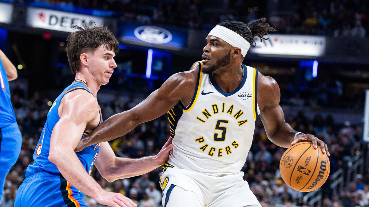 Pacers forward Jarace Walker (5) dribbles the ball while Oklahoma City Thunder forward Brooks Barnhizer (23) defends in the second half at Gainbridge Fieldhouse