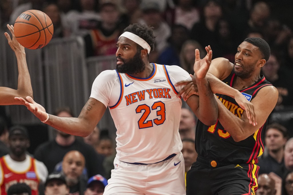 Michael Bradley (left) defends Mitchell Robinson during the Knicks' win over the Hawks on April 6, 2026 at the Garden.