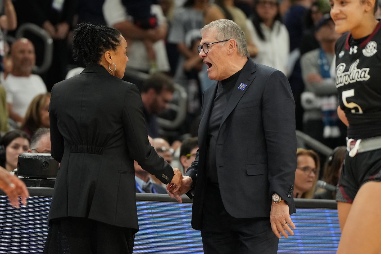 UConn coach Geno Auriemma (right) yells at South Carolina coach Dawn Staley at the end of Friday night's semifinal in Phoenix, won by South Carolina.