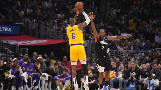 Los Angeles Lakers' LeBron James shoots a three over Clippers All-Star Kawhi Leonard at Crypto.com Arena.