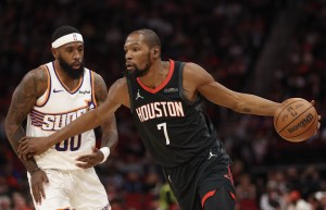 Jan 5, 2026; Houston, Texas, USA; Houston Rockets forward Kevin Durant (7) dribbles against Phoenix Suns forward Royce O'Neale (00) in the first quarter at Toyota Center. Mandatory Credit: Thomas Shea-Imagn Images