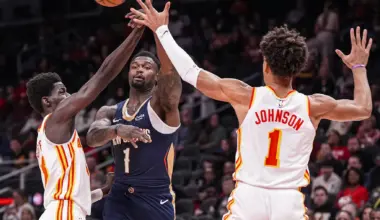 Jan 7, 2026; Atlanta, Georgia, USA; New Orleans Pelicans forward Zion Williamson (1) passes over Atlanta Hawks forwards Mouhamed Gueye (18) and Jalen Johnson (1) during the first half at State Farm Arena. Mandatory Credit: Dale Zanine-Imagn Images