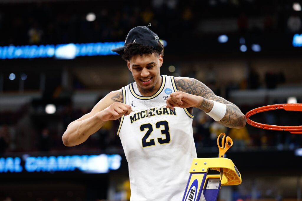 Michigan Wolverines forward Yaxel Lendeborg (23) cuts the net after defeating Tennessee Volunteers in an Elite Eight game of the Midwest Regional of the men's 2026 NCAA Tournament at United Center.