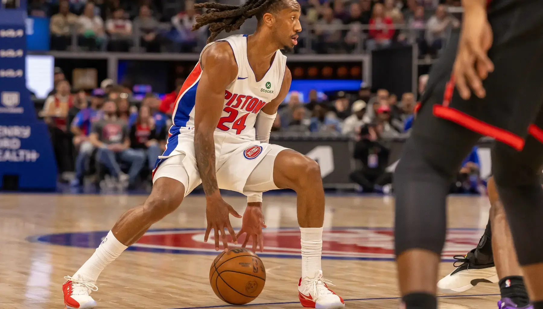 Mar 31, 2026; Detroit, Michigan, USA; Detroit Pistons Daniss Jenkins (24) moves the ball up court against the Toronto Raptors during the first quarter at Little Caesars Arena. Mandatory Credit: David Reginek-Imagn Images