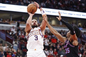 Apr 5, 2026; Chicago, Illinois, USA; Phoenix Suns forward Dillon Brooks (3) shoots against Chicago Bulls forward Isaac Okoro (35) during the second half at United Center. Mandatory Credit: Kamil Krzaczynski-Imagn Images