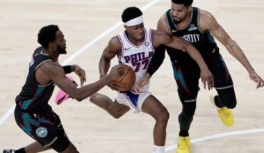Pistons Paul Reed (left) and Tobias Harris (right) squeeze Sixers VJ Edgecombe as he charges down the court in the second half of the Detroit Pistons at Philadelphia 76ers (Sixers) NBA game at Xfinity Mobile Arena in Philadelphia on Saturday, April 4, 2026.