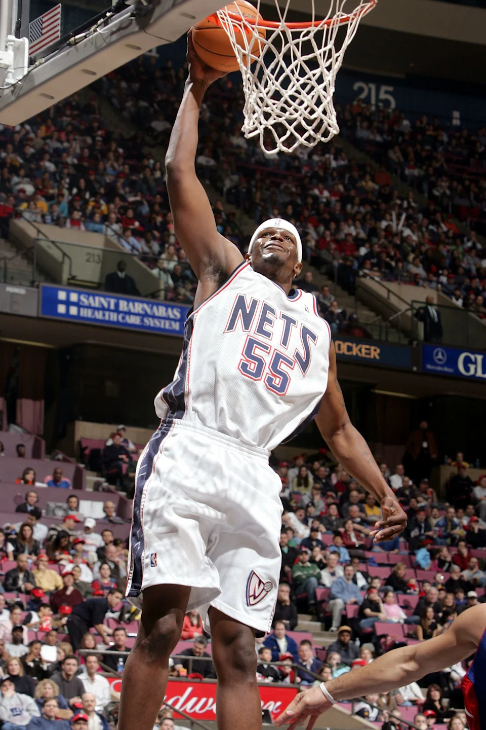 EAST RUTHERFORD, NJ - FEBRUARY 5: Jabari Smith #55 of the New Jersey Nets lays up a basket against the Detroit Pistons on February 5, 2005 at Continental Airlines Arena in East Rutherford, New Jersey. NOTE TO USER: User expressly acknowledges and agrees that, by downloading and/or using this Photograph, user is consenting to the terms and conditions of the Getty Images License Agreement. (Photo by Jim McIsaac/Getty Images)