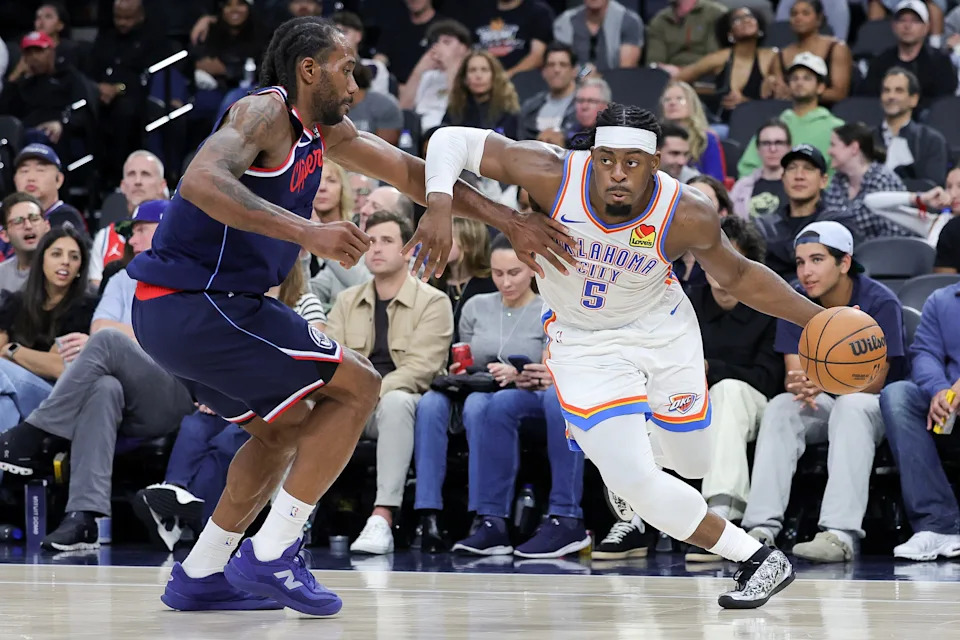 INGLEWOOD, CALIFORNIA - APRIL 08: Luguentz Dort #5 of the Oklahoma City Thunder drives against Kawhi Leonard #2 of the Los Angeles Clippers during the second half of an NBA game at Intuit Dome on April 08, 2026 in Inglewood, California. NOTE TO USER: User expressly acknowledges and agrees that, by downloading and or using this photograph, User is consenting to the terms and conditions of the Getty Images License Agreement. (Photo by Ryan Sirius Sun/Getty Images)