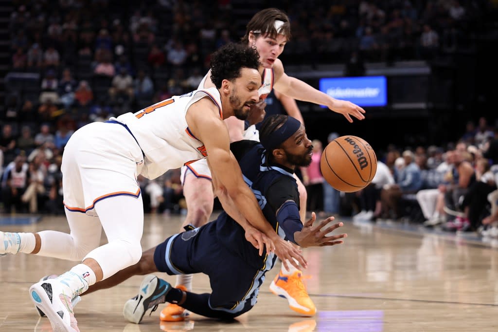 DeJon Jarreau and Landry Shamet are fighting for a loose ball during a basketball game. Getty Images