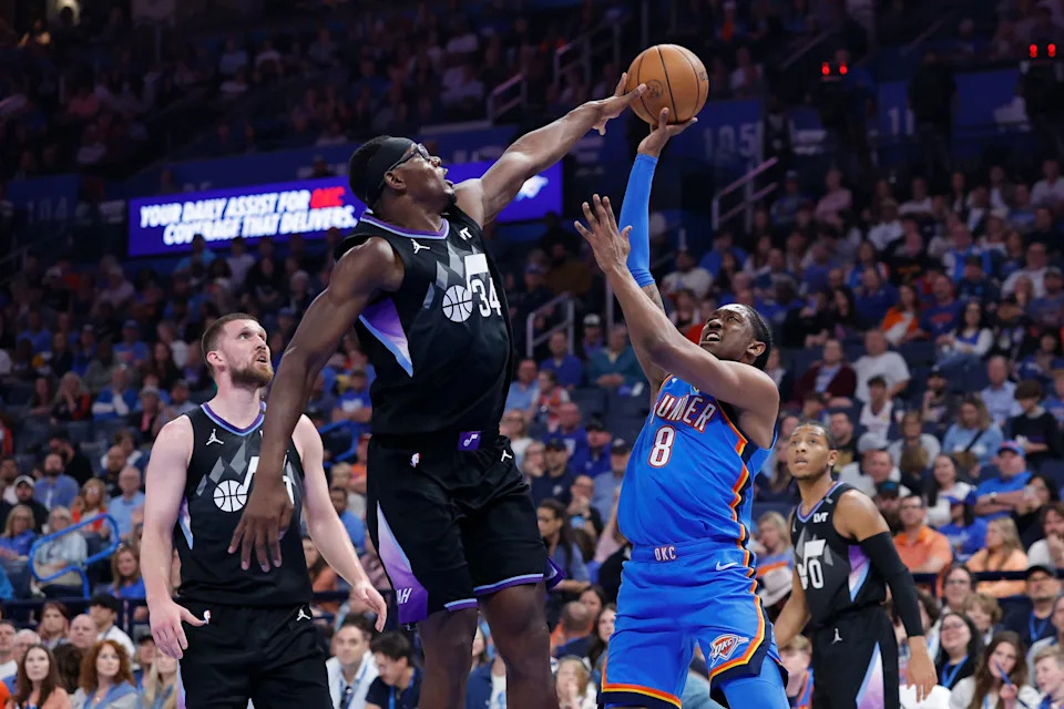 Apr 5, 2026; Oklahoma City, Oklahoma, USA; Utah Jazz center Oscar Tshiebwe (34) blocks a shot by Oklahoma City Thunder guard Jalen Williams (8) during the second quarter at Paycom Center. Mandatory Credit: Alonzo Adams-Imagn Images