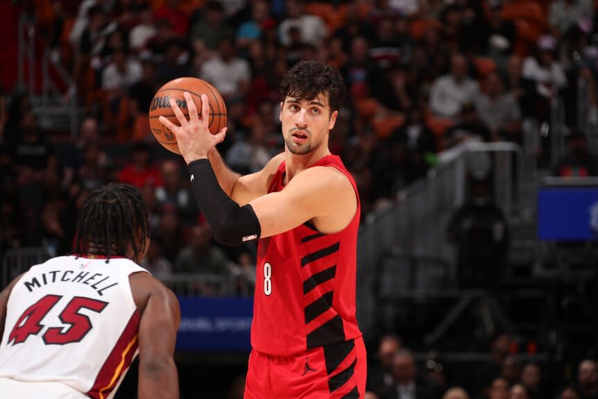 Deni Avdija #8 of the Portland Trail Blazers looks to pass the ball during a game.