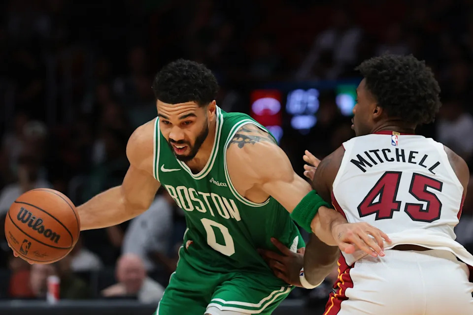 Apr 1, 2026; Miami, Florida, USA; Boston Celtics forward Jayson Tatum (0) drives to the basket against Miami Heat guard Davion Mitchell (45) during the third quarter at Kaseya Center. Mandatory Credit: Sam Navarro-Imagn Images