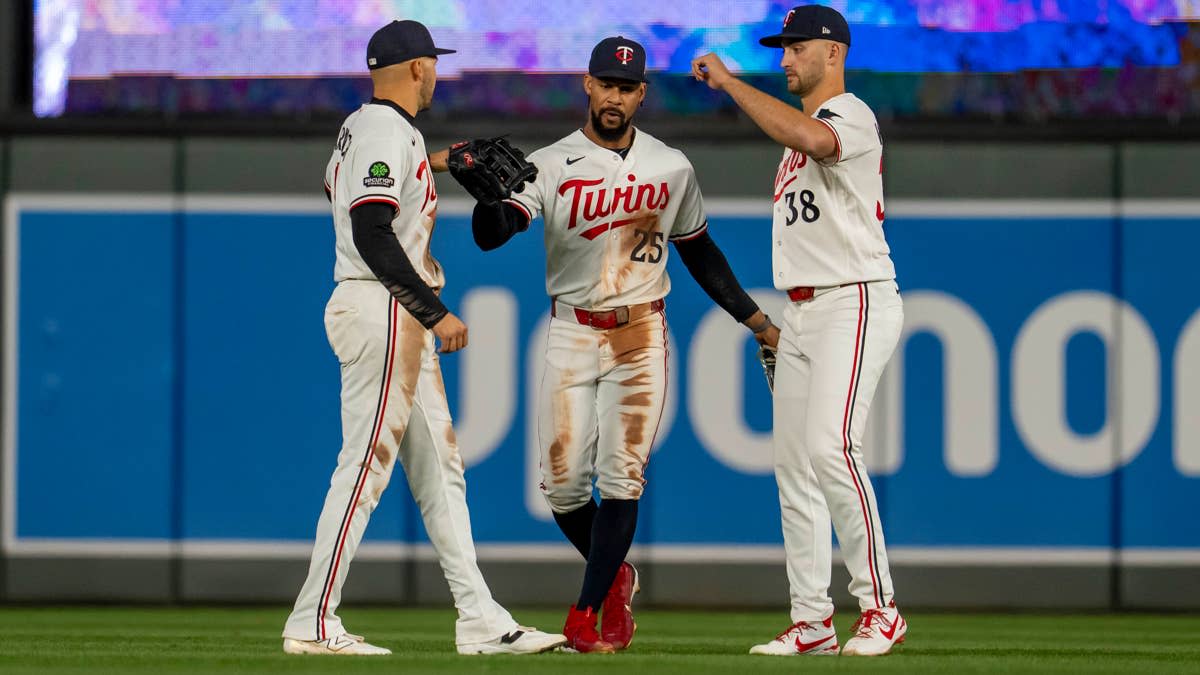 Apr 14, 2026; Minneapolis, Minnesota, USA; Minnesota Twins left fielder Trevor Larnach (9), center fielder Byron Buxton (25) and right fielder Matt Wallner (38) after defeating the Boston Red Sox at Target Field.Jesse Johnson-Imagn Images