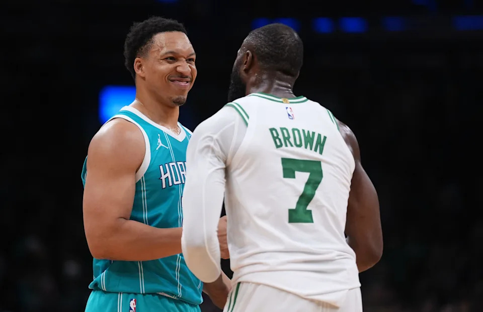 Apr 7, 2026; Boston, Massachusetts, USA; Charlotte Hornets forward Grant Williams (2) and Boston Celtics guard Jaylen Brown (7) meet after the game at TD Garden. Mandatory Credit: David Butler II-Imagn Images