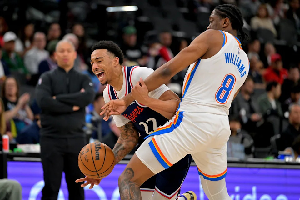 Apr 8, 2026; Inglewood, California, USA; Los Angeles Clippers guard Jordan Miller (22) is fouled by Oklahoma City Thunder guard Jalen Williams (8) in the first half at Intuit Dome. Mandatory Credit: Jayne Kamin-Oncea-Imagn Images