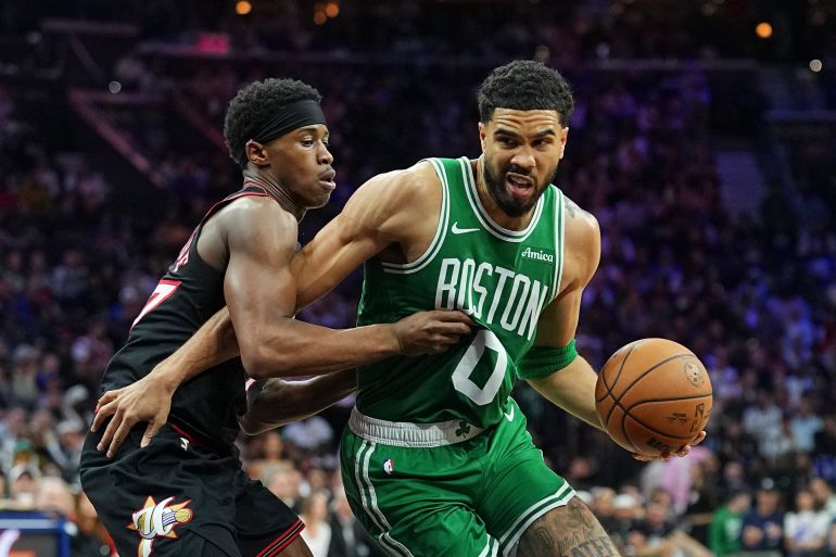 PHILADELPHIA, PENNSYLVANIA - APRIL 24: Jayson Tatum #0 of the Boston Celtics dribbles the ball against Vj Edgecombe #77 of the Philadelphia 76ers in the third quarter during game three of the Eastern Conference first round playoffs at Xfinity Mobile Arena on April 24, 2026 in Philadelphia, Pennsylvania. The Celtics defeated the 76ers 108-100. NOTE TO USER: User expressly acknowledges and agrees that, by downloading and or using this photograph, User is consenting to the terms and conditions of the Getty Images License Agreement. Mitchell Leff/Getty Images/AFP (Photo by Mitchell Leff / GETTY IMAGES NORTH AMERICA / Getty Images via AFP)