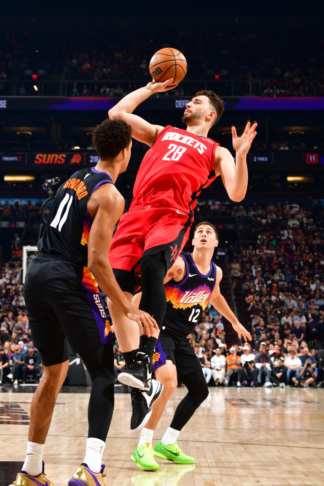 Alperen Sengun (#28) of the Houston Rockets attacks the basket in the matchup against the Phoenix Suns at PHX Arena in Phoenix, Arizona, April 7, 2026. (AFP Photo)