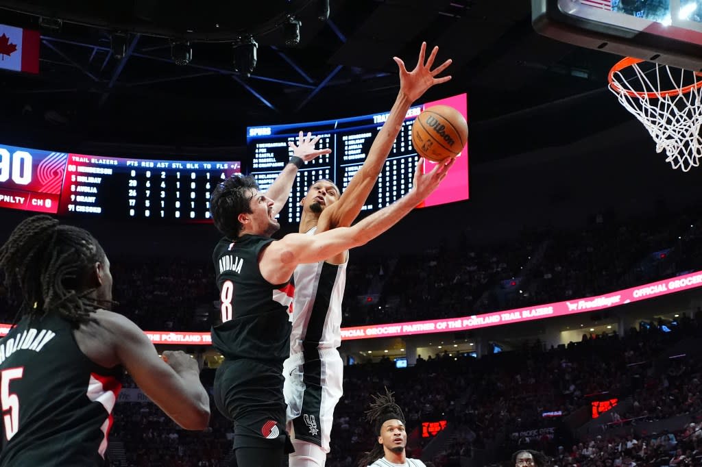 Victor Wembanyama defends during the Spurs’ April 26 game against the Trail Blazers. NBAE via Getty Images