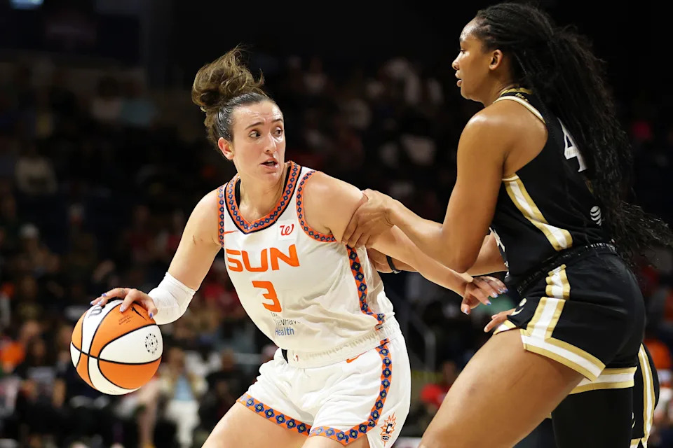 Aug 19, 2025; Washington, District of Columbia, USA; Connecticut Sun guard Marina Mabrey (3) tries to slip past Washington Mystics forward Kiki Iriafen (44) during the second half at CareFirst Arena. Mandatory Credit: Daniel Kucin Jr.-Imagn Images