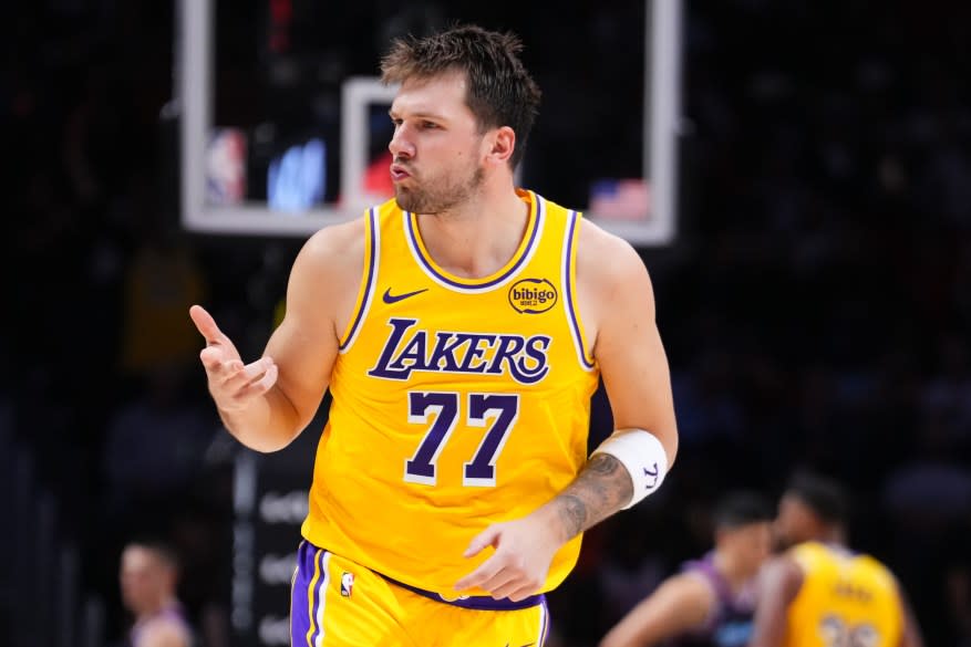 Luka Doncic of the Los Angeles Lakers reacts after scoring a three-pointer against the Miami Heat during the third quarter at Kaseya Center on March 19, 2026 in Miami, Florida. (Photo by Rich Storry/Getty Images)