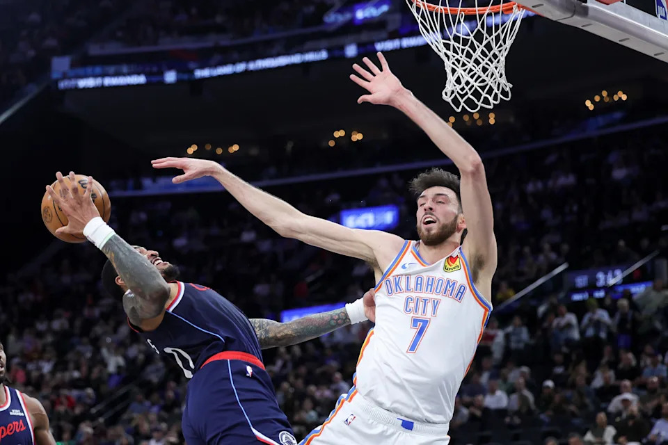 INGLEWOOD, CALIFORNIA - APRIL 08: Chet Holmgren #7 of the Oklahoma City Thunder and John Collins #20 of the Los Angeles Clippers vie for the ball during the first half of an NBA game at Intuit Dome on April 08, 2026 in Inglewood, California. NOTE TO USER: User expressly acknowledges and agrees that, by downloading and or using this photograph, User is consenting to the terms and conditions of the Getty Images License Agreement. (Photo by Ryan Sirius Sun/Getty Images)