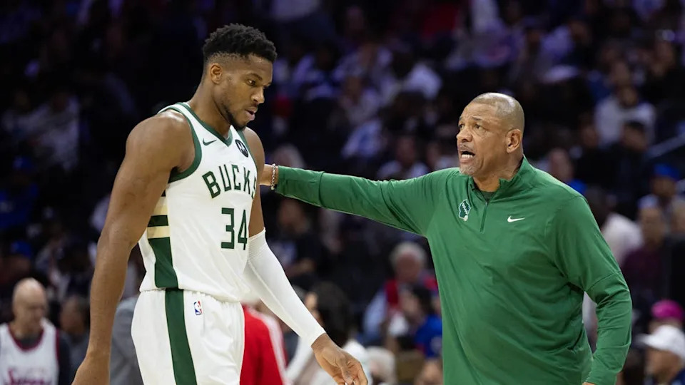 Milwaukee Bucks head coach Doc Rivers talks with forward Giannis Antetokounmpo (34) during the third quarter against the Philadelphia 76ers at Wells Fargo Center. Bill Streicher-Imagn Images