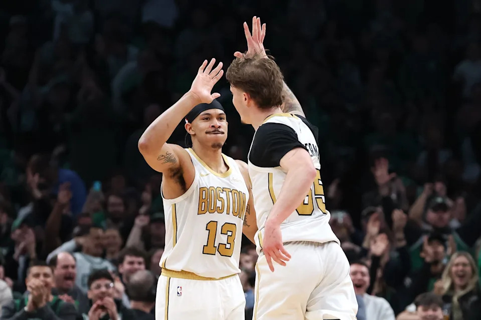 Apr 12, 2026; Boston, Massachusetts, USA; Boston Celtics forward Ron Harper Jr (13) and Boston Celtics guard Baylor Scheierman (55) celebrate during the second half against the Orlando Magic at TD Garden. Mandatory Credit: Paul Rutherford-Imagn Images