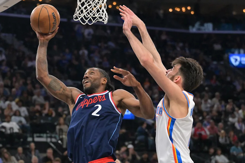 Apr 8, 2026; Inglewood, California, USA; Los Angeles Clippers forward Kawhi Leonard (2) gets past Oklahoma City Thunder center Chet Holmgren (7) for a basket in the first half at Intuit Dome. Mandatory Credit: Jayne Kamin-Oncea-Imagn Images