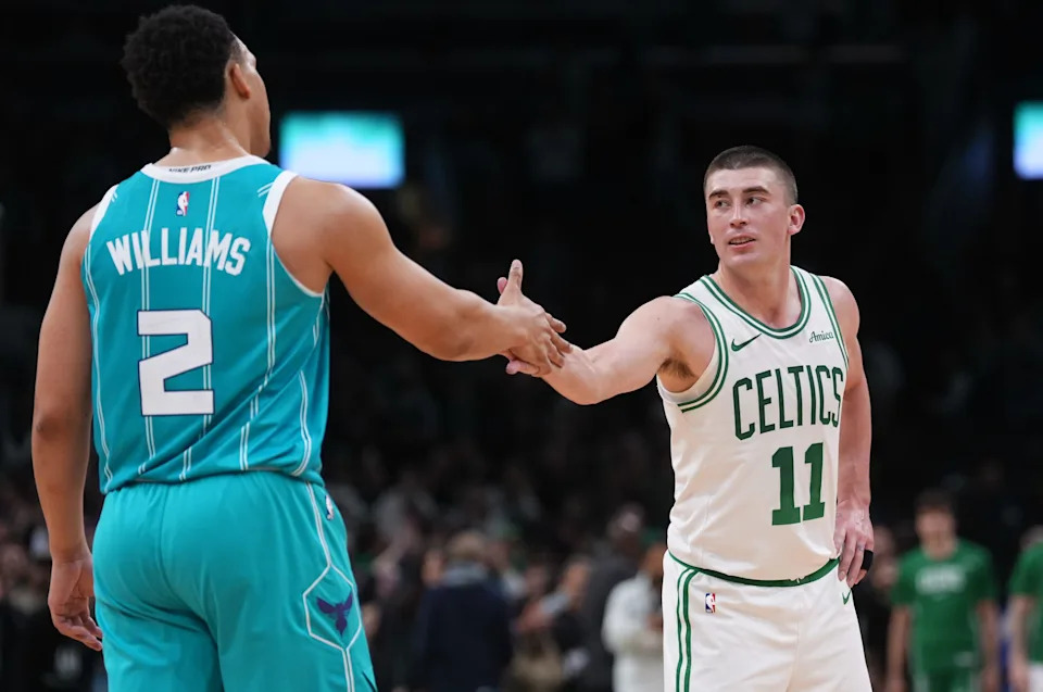 Apr 7, 2026; Boston, Massachusetts, USA; Charlotte Hornets forward Grant Williams (2) and Boston Celtics guard Payton Pritchard (11) meet after the game at TD Garden. Mandatory Credit: David Butler II-Imagn Images