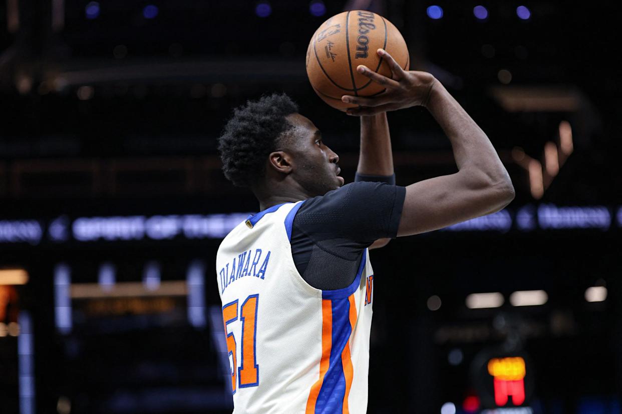 An image collage containing 1 images, Image 1 shows New York Knicks forward Mohamed Diawara (51) shoots the ball