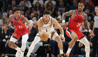 Devin Booker of the Phoenix Suns handles against the Los Angeles Clippers, who are chasing Phoenix ...