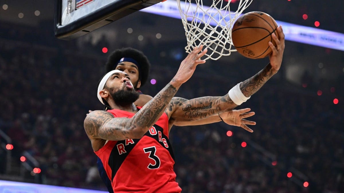 Toronto Raptors forward Brandon Ingram drives to the basket against Cleveland Cavaliers center Jarrett Allen at Rocket Arena