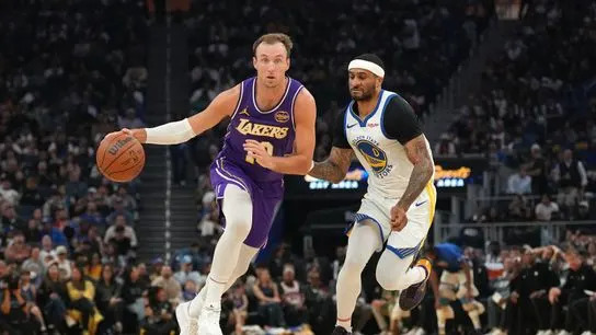Los Angeles Lakers guard Luke Kennard (10) dribbles the ball against Golden State Warriors guard Gary Payton II (0) in the second quarter at the Chase Center. 