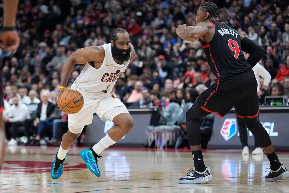 Cleveland Cavaliers guard James Harden (1) drives to the basket as Toronto Raptors forward RJ Barrett (9) defends during Game 3 of an NBA playoff first-round series April 23, 2026, in Toronto, Ontario.