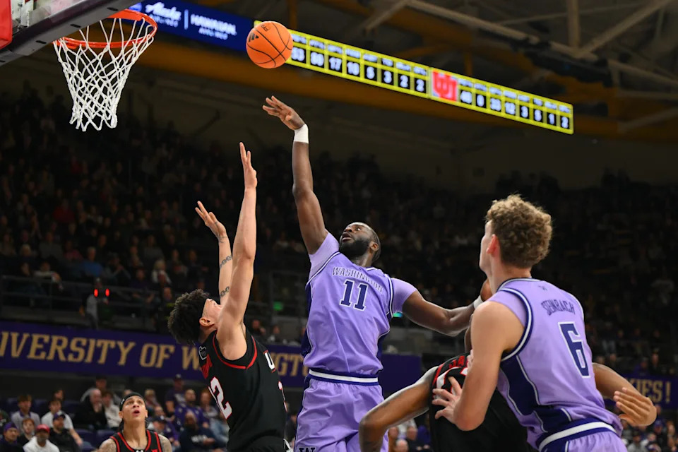 Dec 29, 2025; Seattle, Washington, USA; Washington Huskies center Franck Kepnang (11) shoots the ball against the Utah Utes during the first half at Alaska Airlines Arena at Hec Edmundson Pavilion. Mandatory Credit: Steven Bisig-Imagn Images