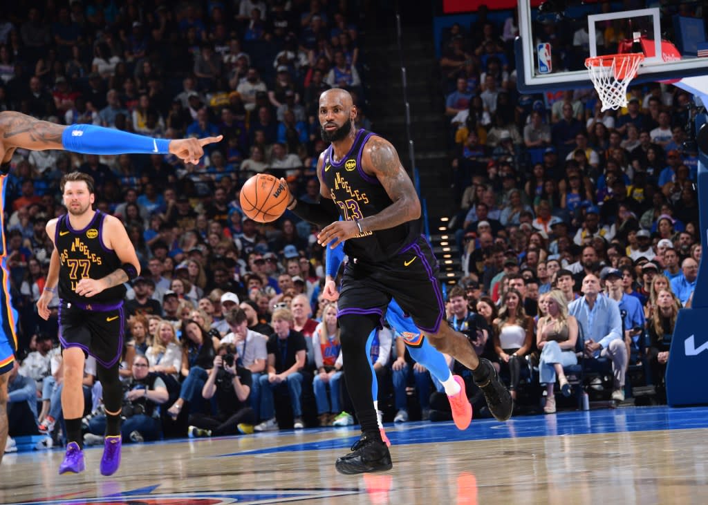 LeBron James brings the ball up court against the Thunder. NBAE via Getty Images