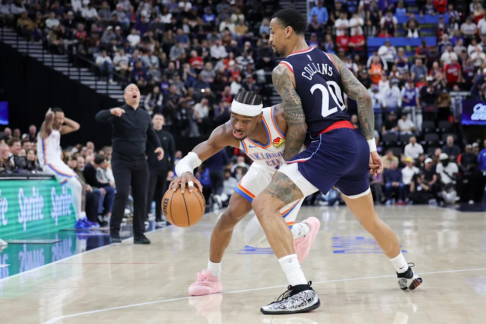 INGLEWOOD, CALIFORNIA - APRIL 08: Shai Gilgeous-Alexander #2 of the Oklahoma City Thunder drives against John Collins #20 of the Los Angeles Clippers during the second half of an NBA game at Intuit Dome on April 08, 2026 in Inglewood, California. NOTE TO USER: User expressly acknowledges and agrees that, by downloading and or using this photograph, User is consenting to the terms and conditions of the Getty Images License Agreement. (Photo by Ryan Sirius Sun/Getty Images)
