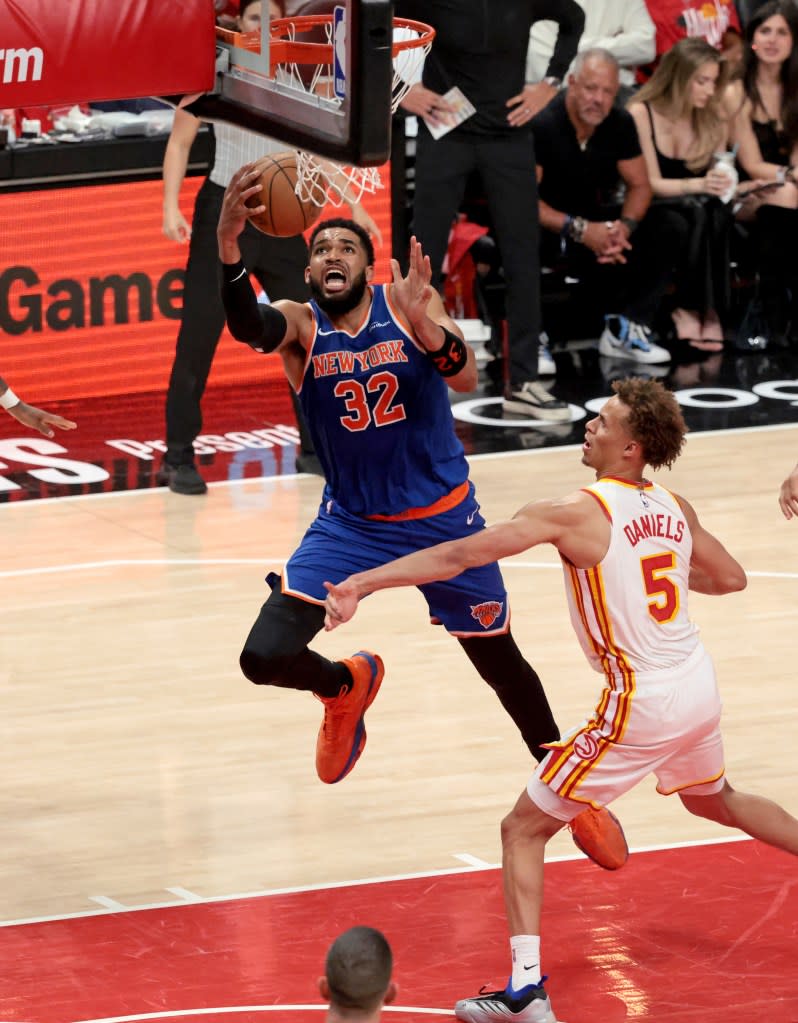 New York Knicks center Karl-Anthony Towns (32) goes up for a shot in front of Atlanta Hawks guard Dyson Daniels (5) during the third quarter. Charles Wenzelberg / New York Post