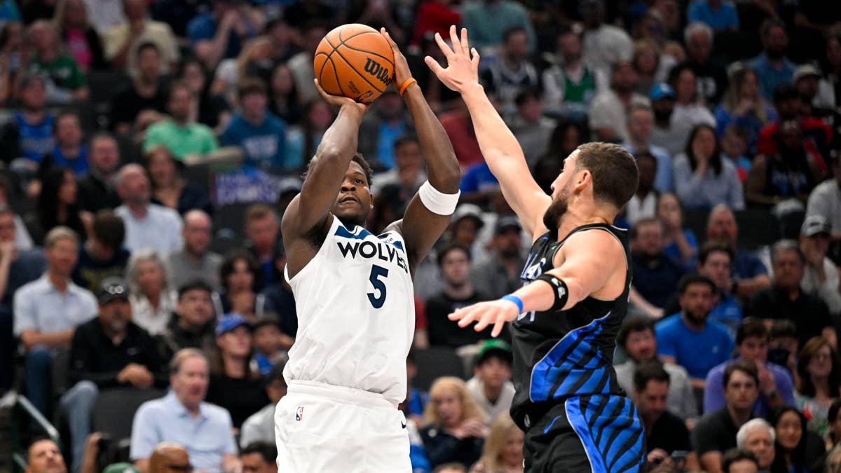 Minnesota Timberwolves guard Anthony Edwards (5) makes a jump shot over Dallas Mavericks guard Klay Thompson (31) during the second quarter at the American Airlines Center. Jerome Miron-Imagn Images